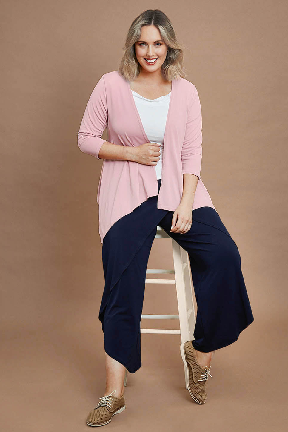 Model Jessk wearing size 14 of the The Drape Cardi - Blushpink in colour Blushpink, from the front