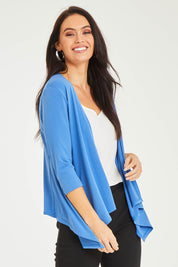 Model Stacey wearing size 10 of The Drape Cardi in colour Denimblue (Blue), from the front, cropped image