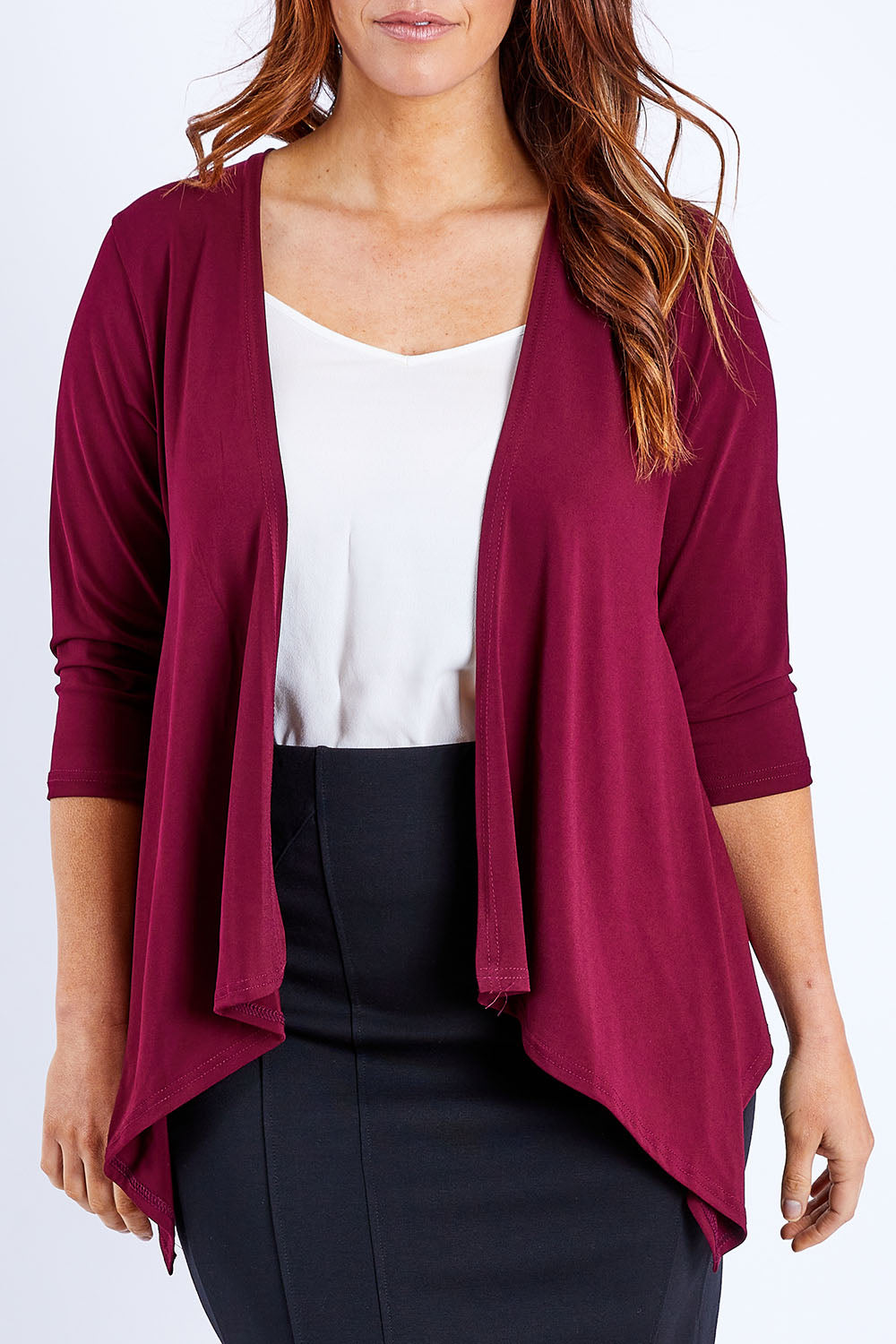 Model Laura wearing size 12 of The Drape Cardi in colour Port (Purple), from the front, cropped image