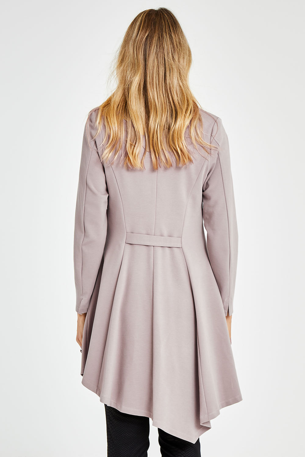 Model Kelly wearing size 10 of The Asymmetrical Hem Coat in colour String, from the back