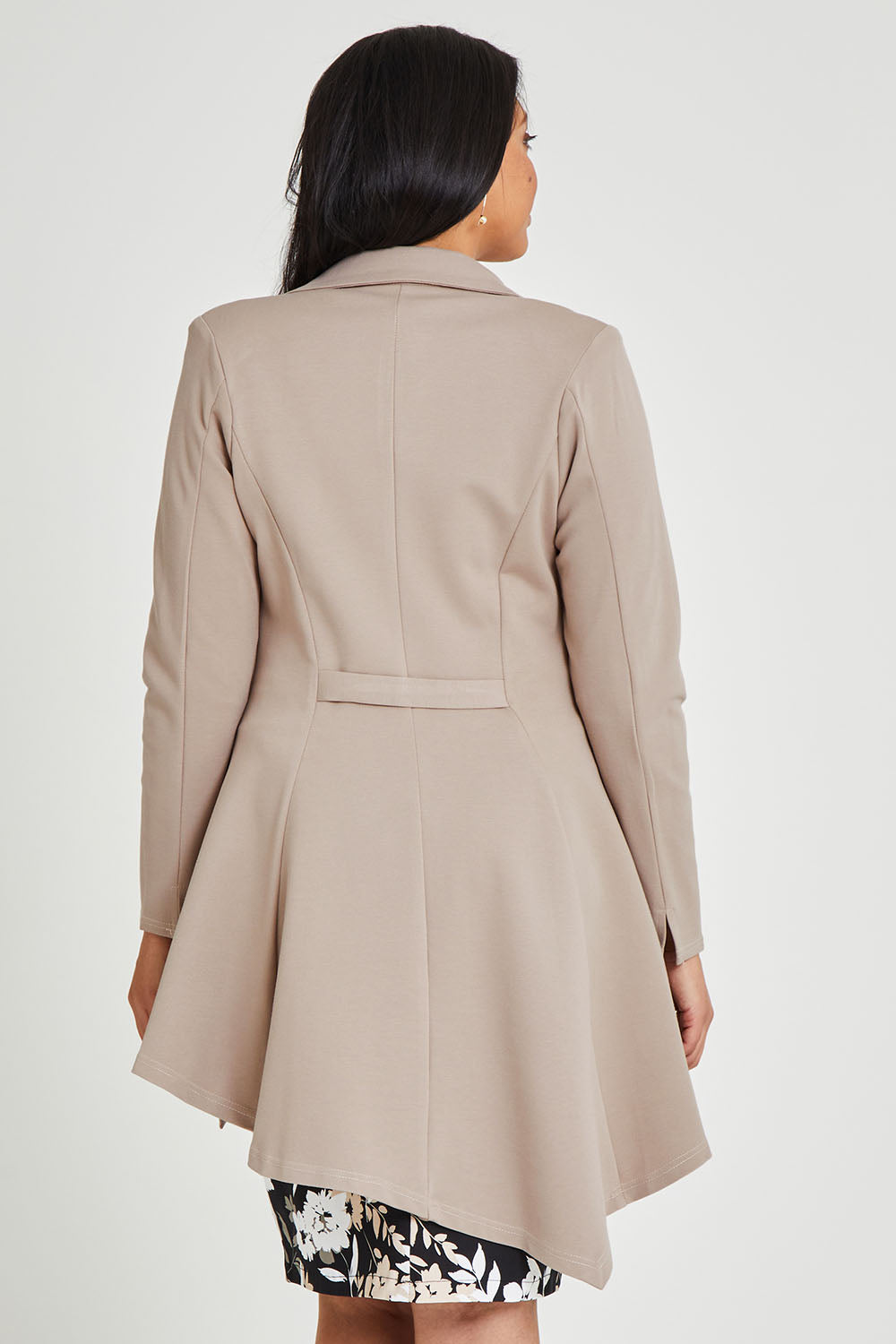 Model Terri-Leigh wearing size 14 of The Asymmetrical Hem Coat in colour String, from the back