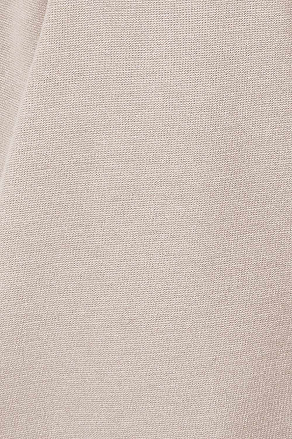Product shot of The Asymmetrical Hem Coat in colour String, detail