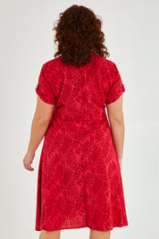 Model Maddy wearing size 16 of The Printed Cotton V Neck Dress in colour Bamboo (Red), from the back