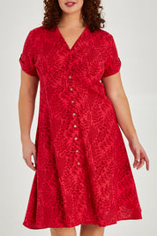 Model Maddy wearing size 16 of The Printed Cotton V Neck Dress in colour Bamboo (Red), from the front, cropped image