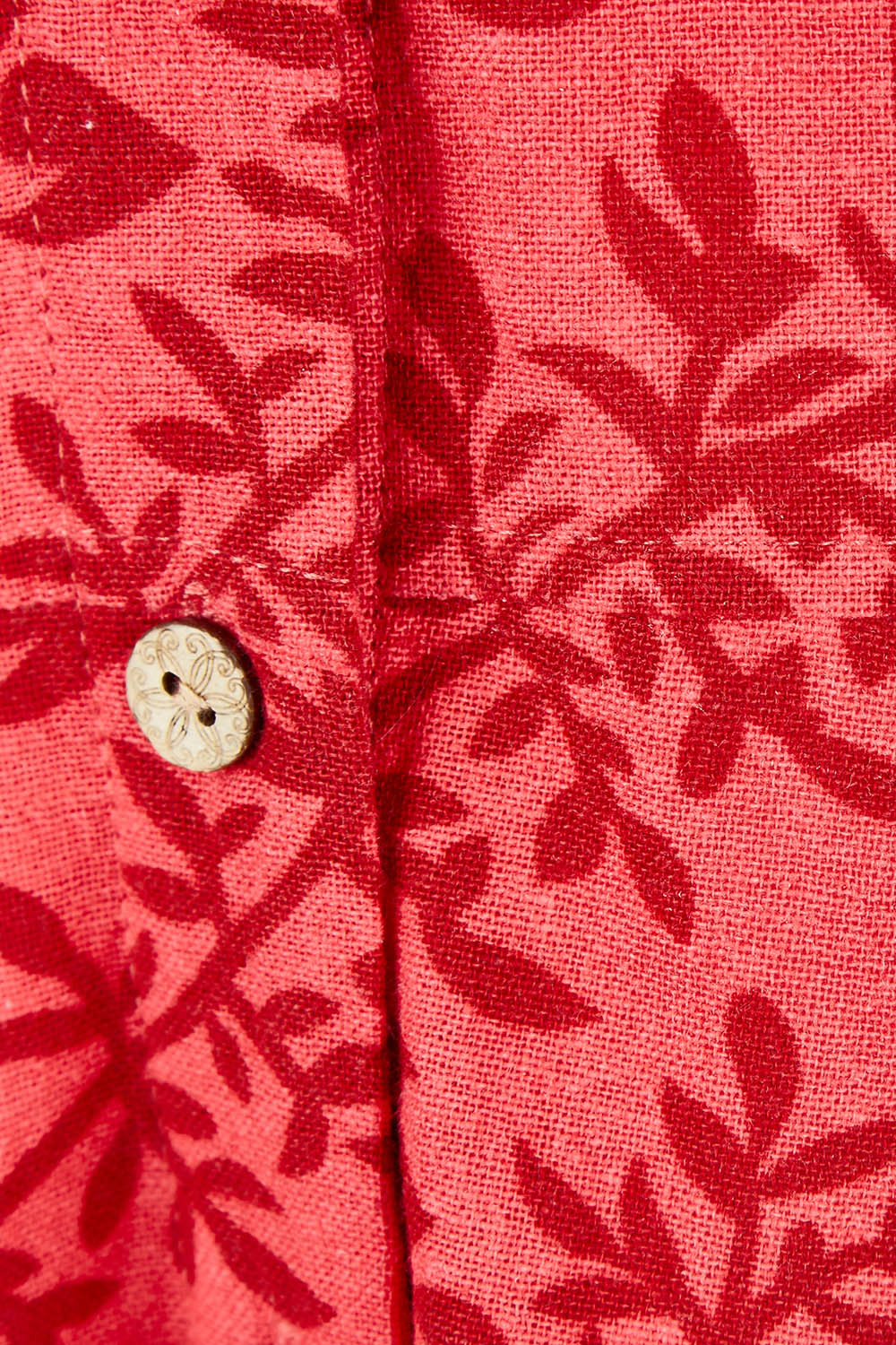 Product shot of The Printed Cotton V Neck Dress in colour Bamboo (Red), detail