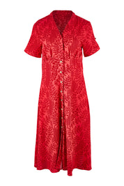 Product shot of The Printed Cotton V Neck Dress in colour Bamboo (Red), from the front