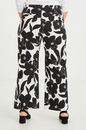 Model Katie wearing size 16 of The Printed Cotton Stretch Pant in colour Blkfloral (Black), from the back