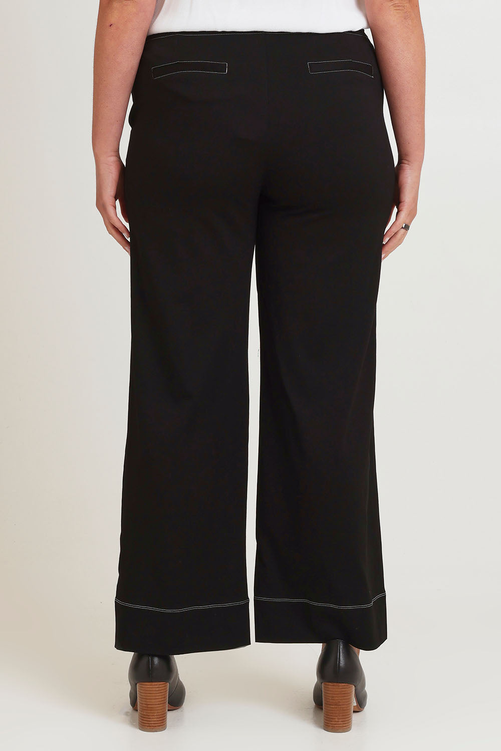 Model Chanel wearing size 16 of The Contrast Stitching Stretch Pant in colour Black (Black), from the back