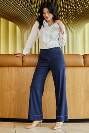 Model Miranda wearing size 10 of The Contrast Stitching Stretch Pant in colour Navy (Blue), from the front, showing the whole outfit