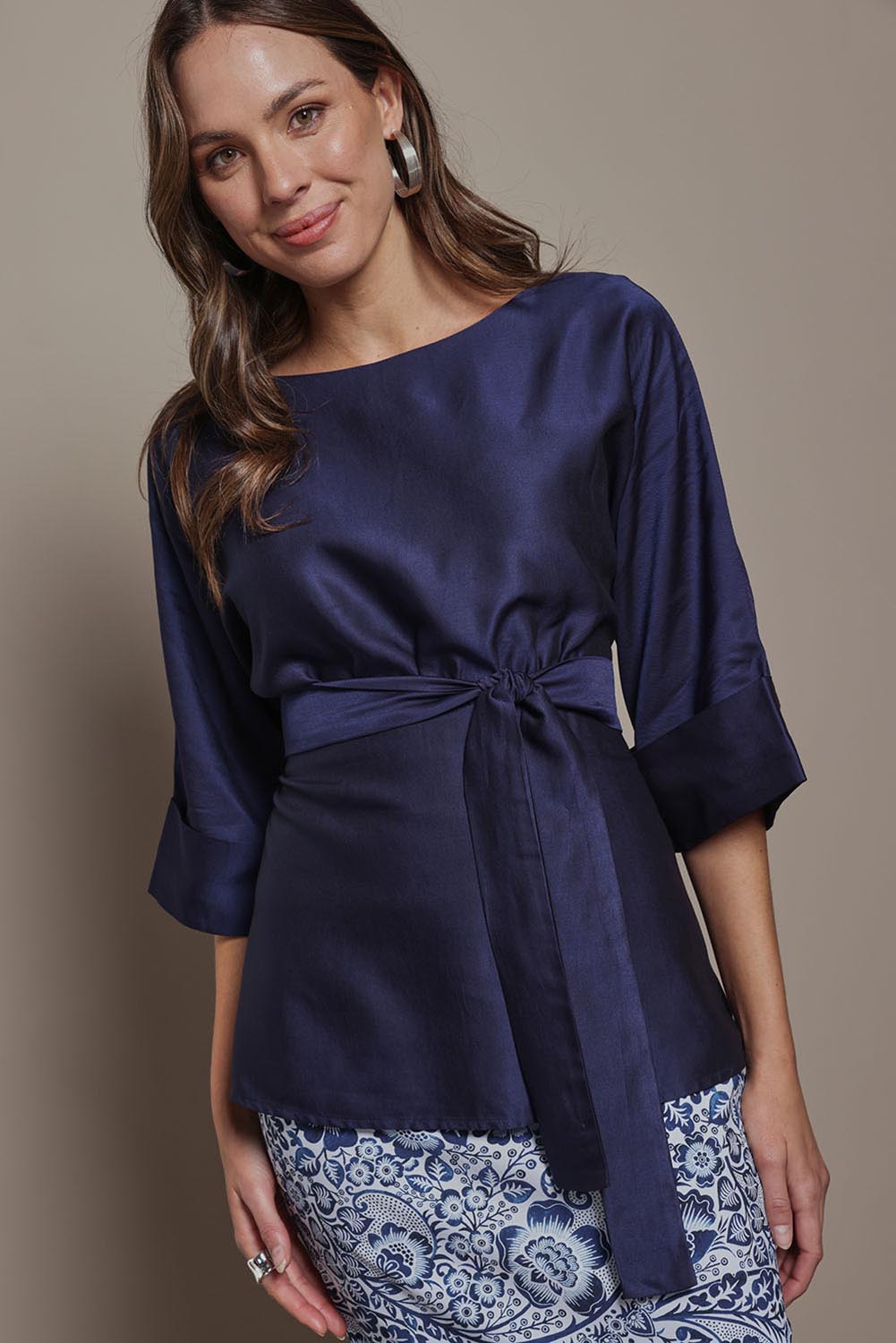 Model Madeline wearing size 10 of The Luxe Dolman Sleeve Blouse in colour Darkcobalt (Blue), from the front, cropped image