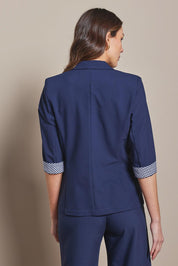 Model Madeline wearing size 10 of The Contrast Inner Cuff Blazer in colour Navy (Blue), from the back