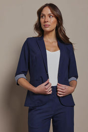 Model Madeline wearing size 10 of The Contrast Inner Cuff Blazer in colour Navy (Blue), from the front, cropped image