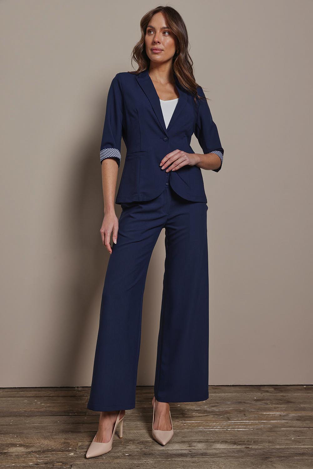 Model Madeline wearing size 10 of The Contrast Inner Cuff Blazer in colour Navy (Blue), from the front, showing the whole outfit