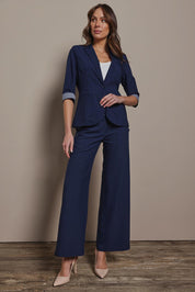 Model Madeline wearing size 10 of The Contrast Inner Cuff Blazer in colour Navy (Blue), from the front, showing the whole outfit