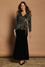 Model Madeline wearing size 10 of The Printed Velvet Side Ring Detail Top in colour Leopard (Black), from the front, showing the whole outfit