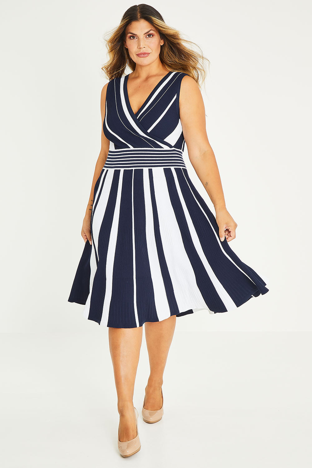 Model Palatina wearing size XL of The Reversible Knit Dress in colour Navystripe (Blue), from the front, showing the whole outfit