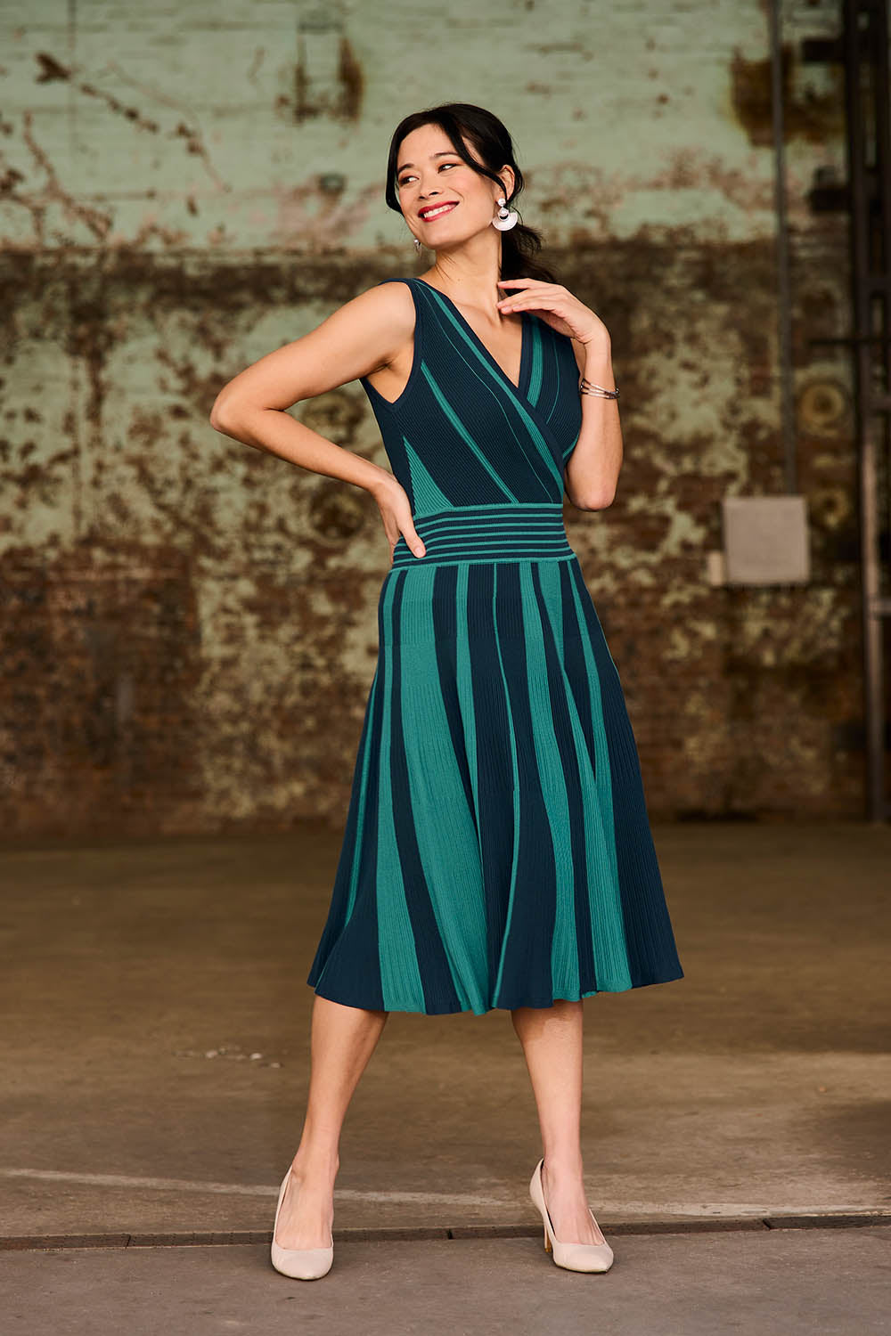 Model Miranda wearing size S of The Reversible Knit Dress in colour Peacock (Blue), from the front, showing the whole outfit