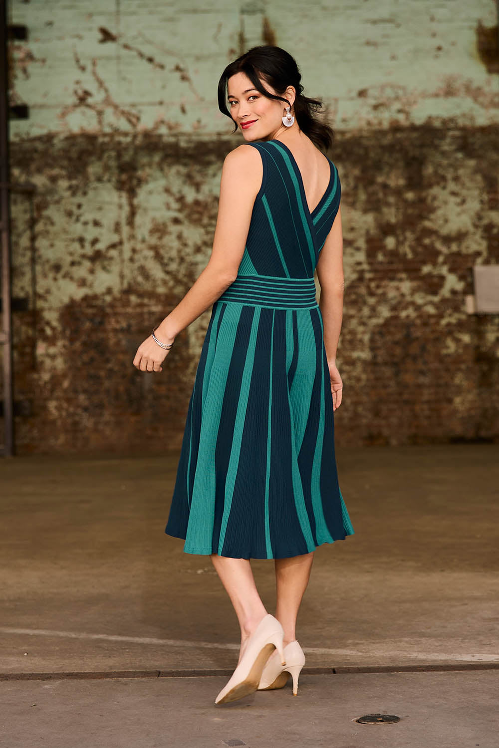 Model Miranda wearing size S of The Reversible Knit Dress in colour Peacock (Blue), from the front, showing the whole outfit