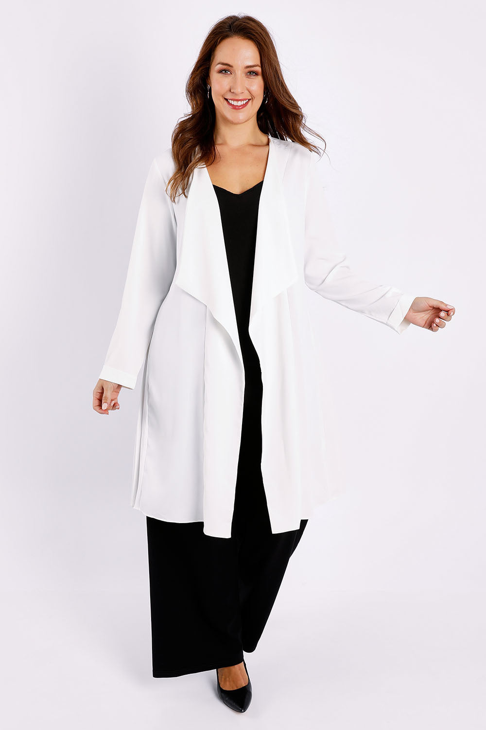 Model Jessica wearing size 14 of The Pleated Back Soft Fall Duster Jacket in colour White (White), from the front, showing the whole outfit