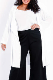 Model Sasha-Lee wearing size 16 of The Pleated Back Soft Fall Duster Jacket in colour White (White), from the front, cropped image