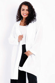 Model Sasha-Lee wearing size 16 of The Pleated Back Soft Fall Duster Jacket in colour White (White), from the front, cropped image