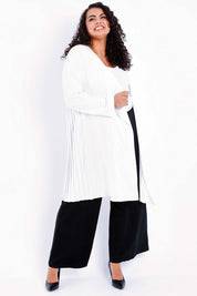 Model Sasha-Lee wearing size 16 of The Pleated Back Soft Fall Duster Jacket in colour White (White), from the front, showing the whole outfit