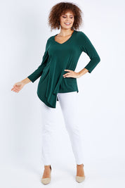 Model Lala wearing size 10 of The Fold Detail Blouse in colour Forest (Green), from the front, showing the whole outfit