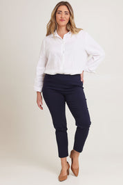 Model Chanel wearing size 16 of The Stretch Career Pull On Pant in colour Navy (Blue), from the front, showing the whole outfit