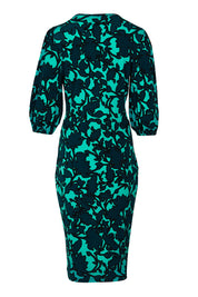 Product shot of The Printed Knot Waist Detail Dress in colour Tealfleur (Green), from the back