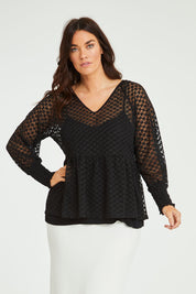 Model Laura wearing size 14 of The Smocked Cuff Lace Blouse in colour Black (Black), from the front, cropped image