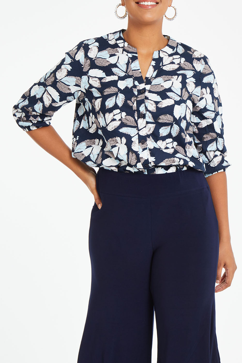 Model Noli wearing size 14 of The 3/4 Sleeve Cotton Shirt in colour Leaf (Blue), from the front, cropped image