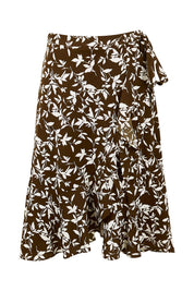 Product shot of The Lined Faux Wrap Ruffle Skirt in colour Vines, from the front