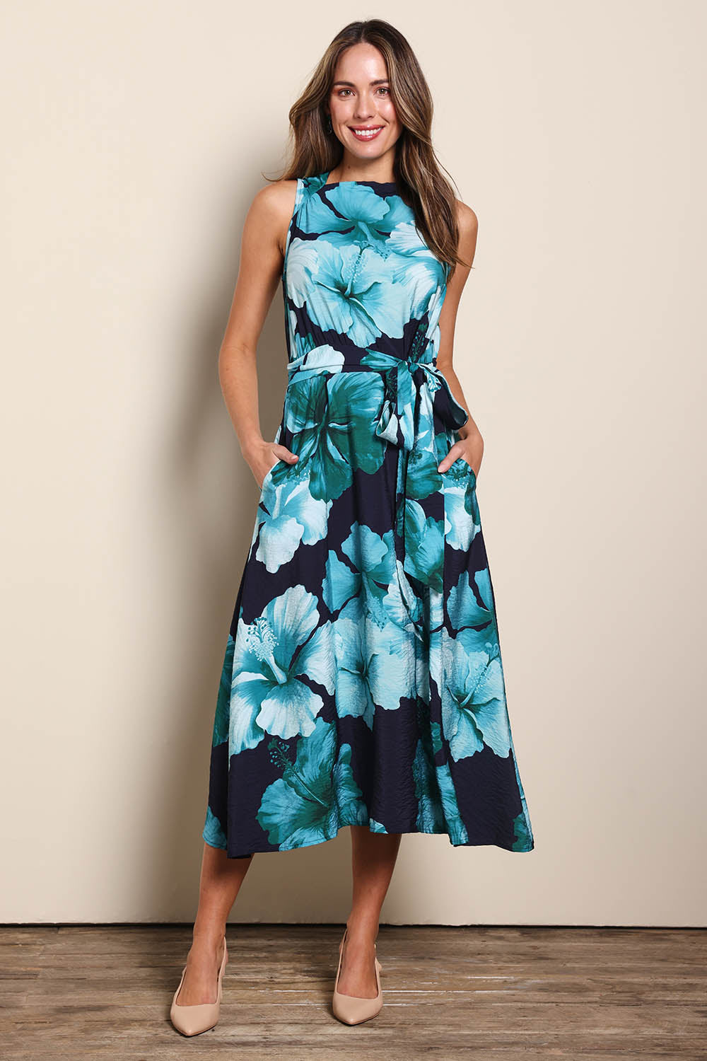 Model Madelinec wearing size 10 of the The Printed Adore Dress - Greenhibiscus in colour Greenhibiscus, from the front