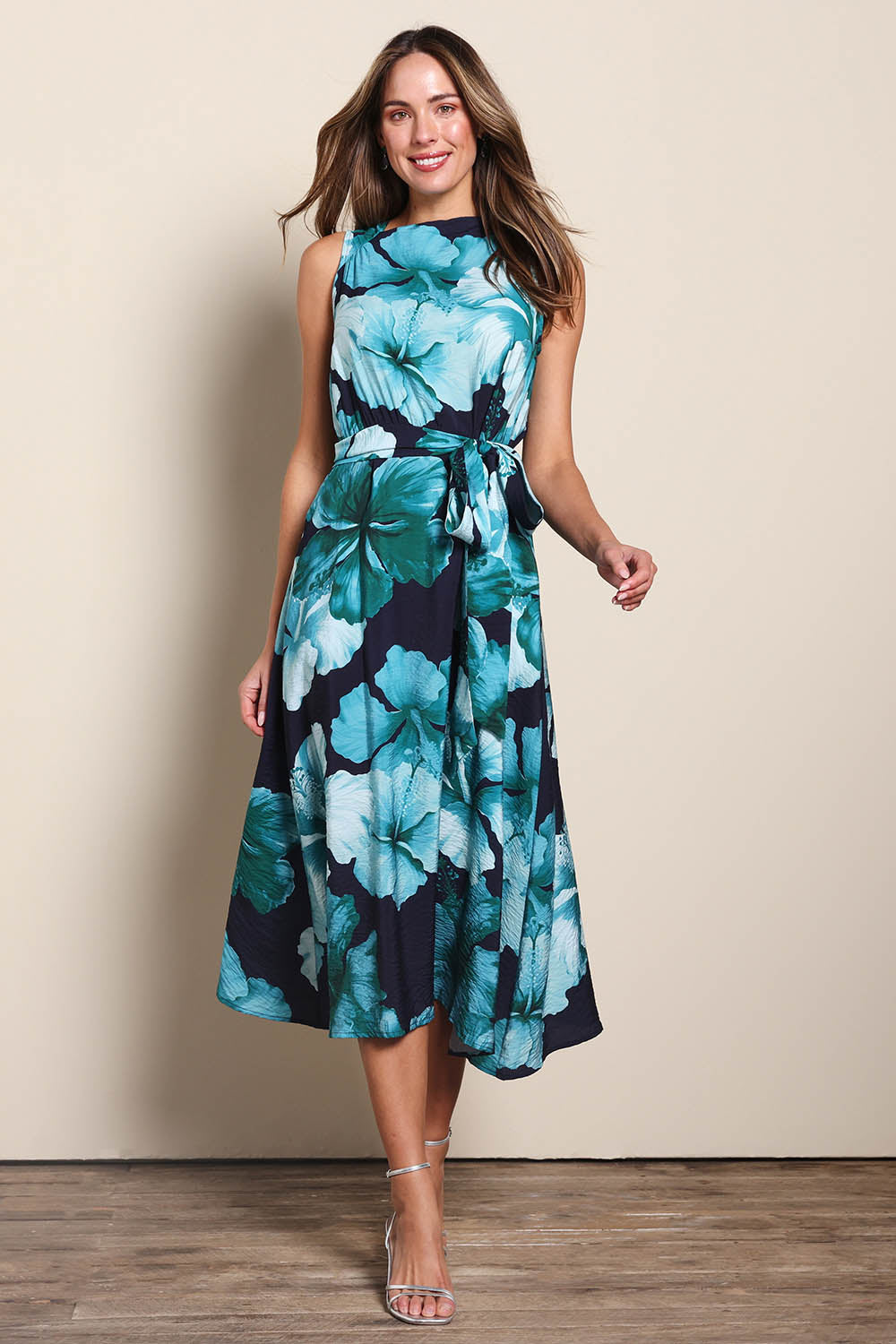 Model Madelinec wearing size 10 of the The Printed Adore Dress - Greenhibiscus in colour Greenhibiscus, from the front