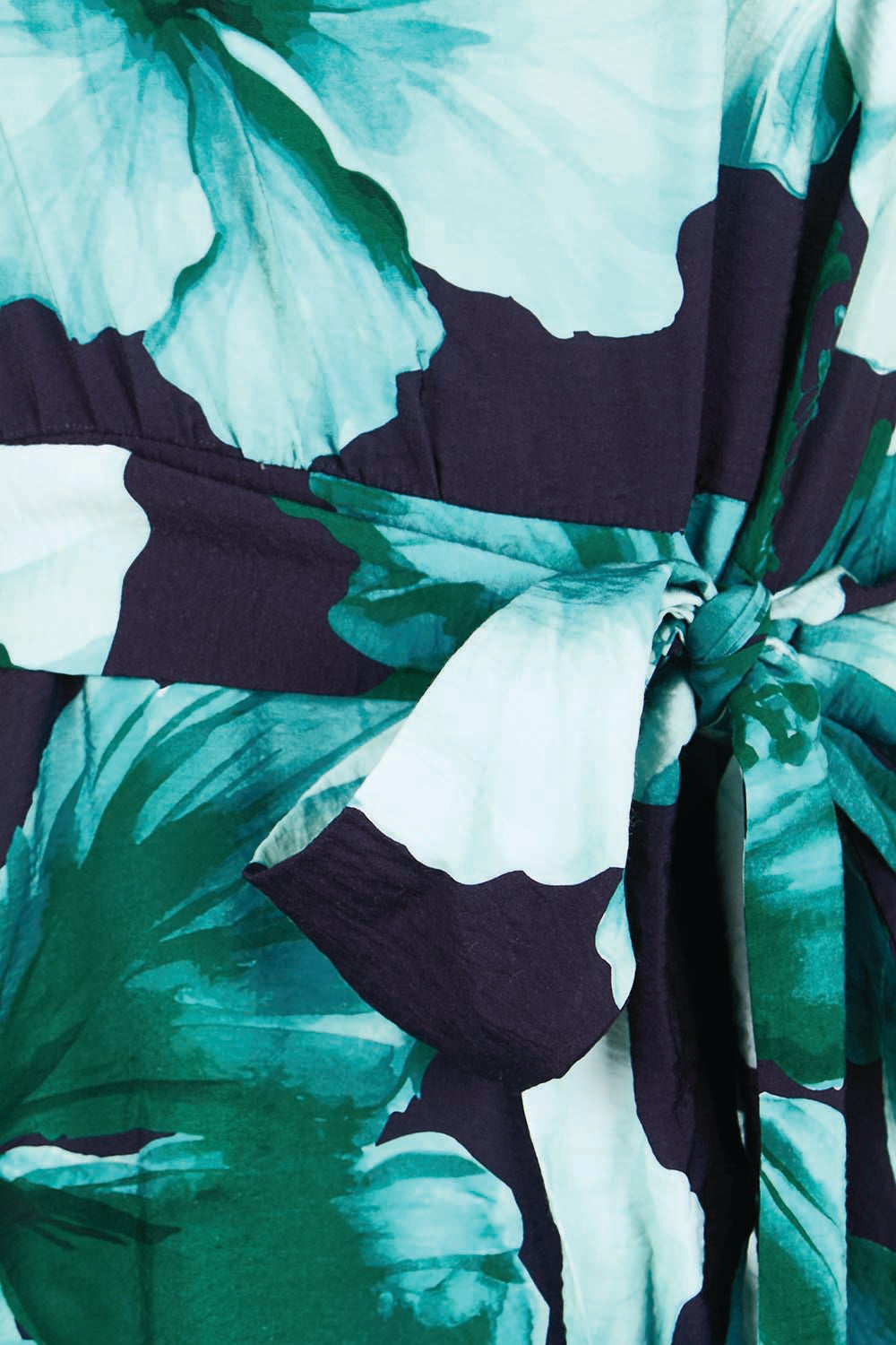 Product shot of the The Printed Adore Dress - Greenhibiscus in colour Greenhibiscus, showing detail
