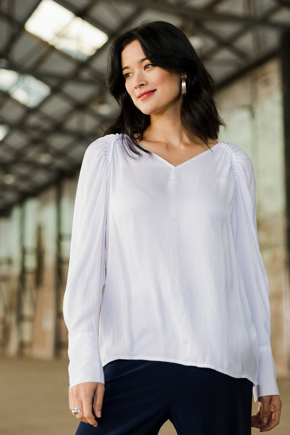 Model Miranda wearing size 10 of The Pleated Raglan Sleeve Blouse in colour White (White), from the front, showing the whole outfit