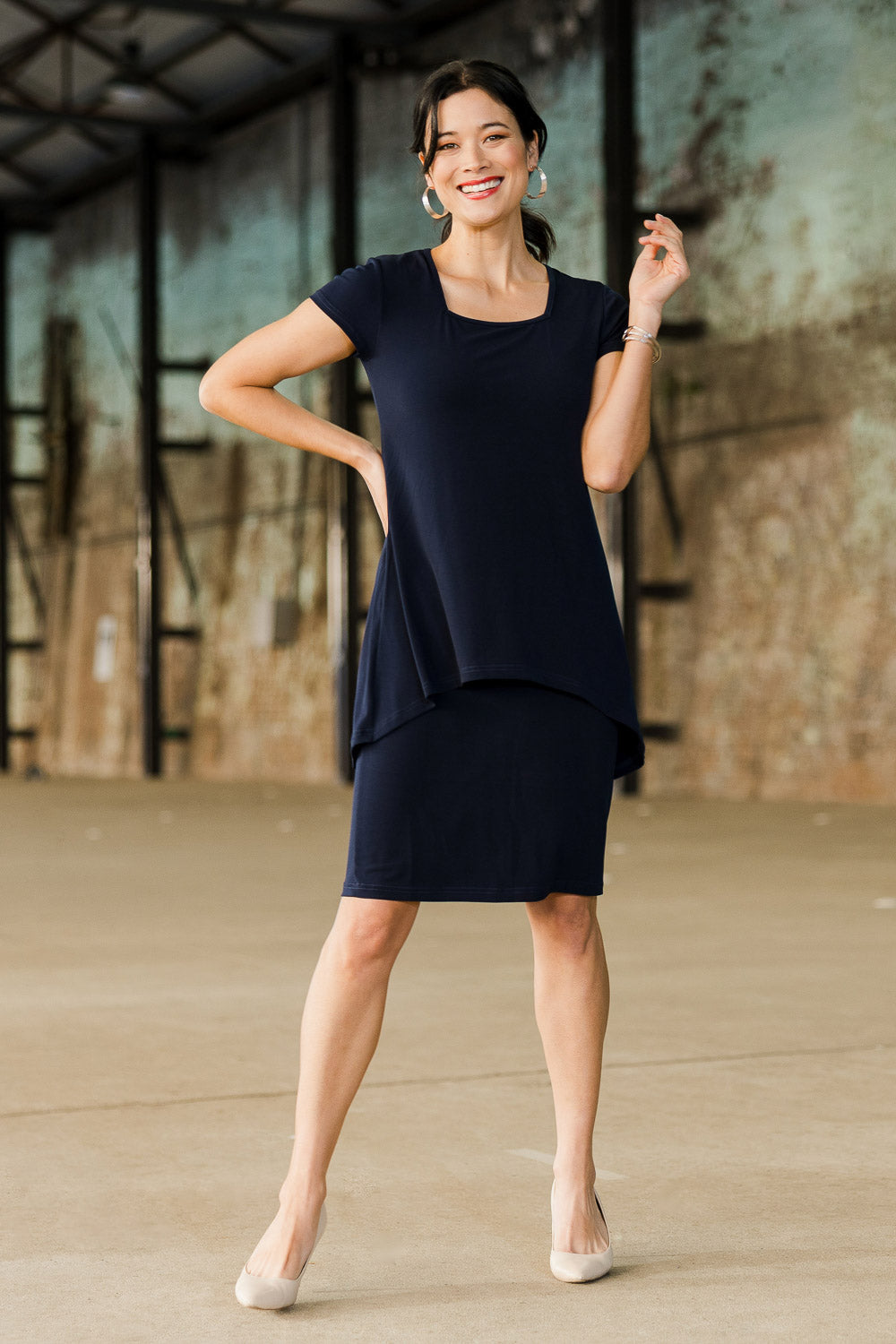 Model Miranda wearing size 10 of The Short Sleeve Rita Dress in colour Navy (Blue), from the front, showing the whole outfit