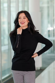 Model Miranda wearing size S of The Button Detail Knit Jumper in colour Black (Black), from the front, showing the whole outfit