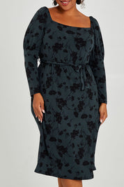 Model Alexis wearing size 16 of The Square Neck Dress in colour Poppy (Green), from the front, cropped image