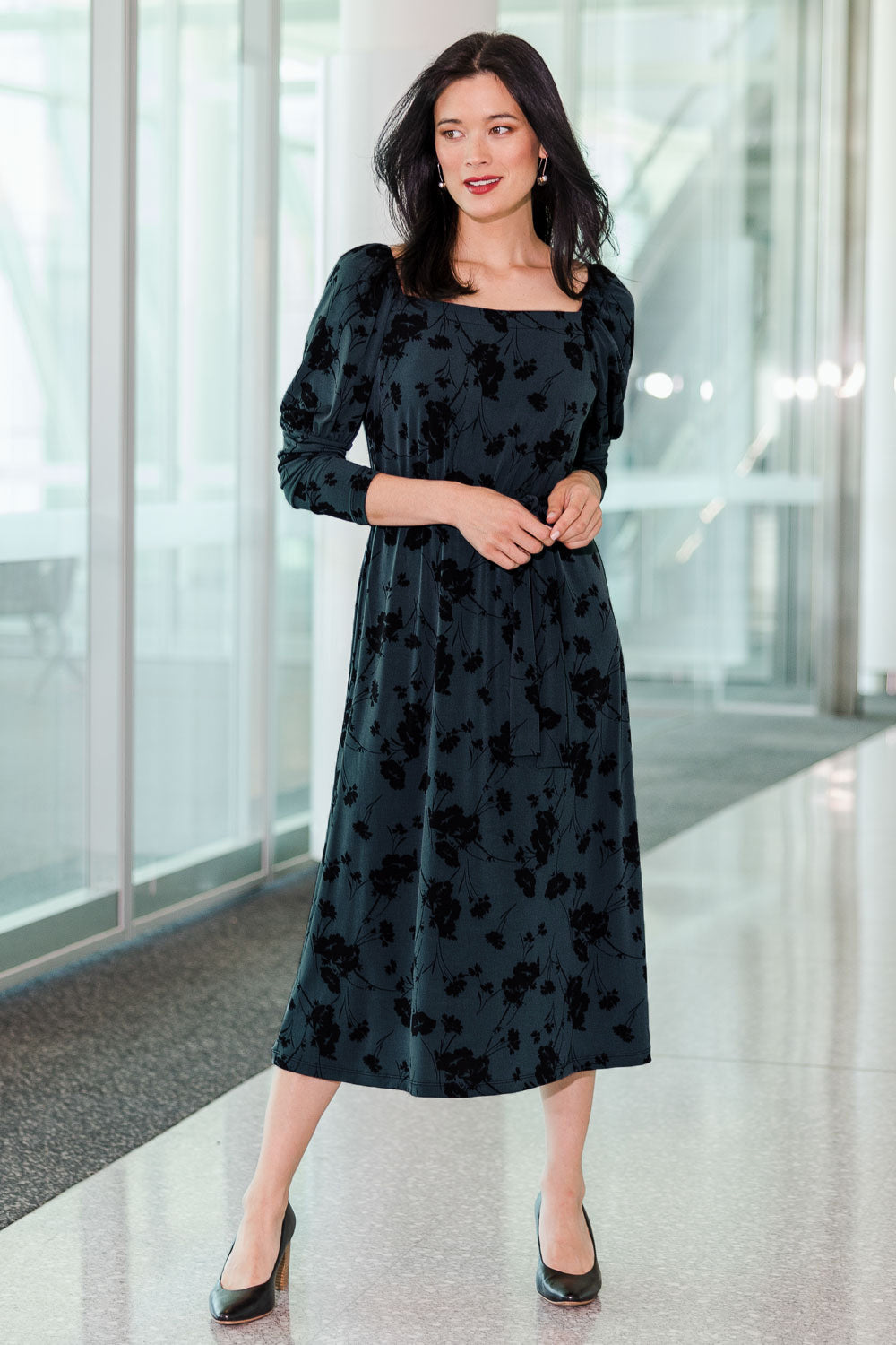 Model Miranda wearing size 10 of The Square Neck Dress in colour Poppy (Green), from the front, showing the whole outfit