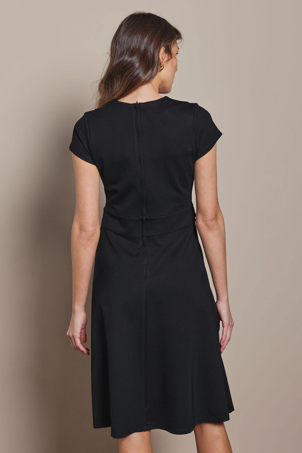 Model Madeline wearing size 10 of The Cap Sleeve Ponte Lapel Dress in colour Black (Black), from the back