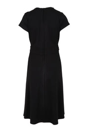 Product shot of The Cap Sleeve Ponte Lapel Dress in colour Black (Black), from the back