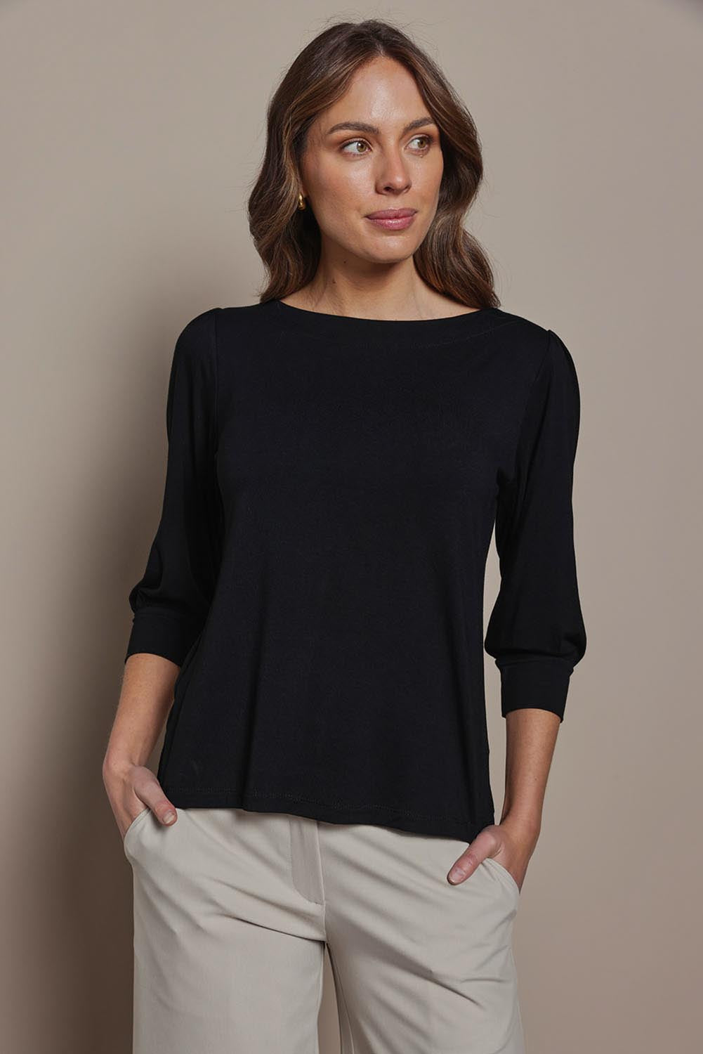Model Madeline wearing size 10 of The Bamboo Boat Neck Top in colour Black (Black), from the front, cropped image