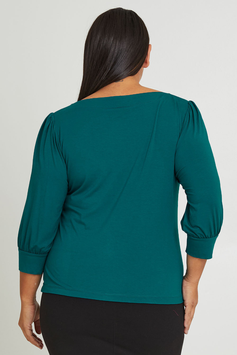 Model Ashleigh wearing size 16 of The Bamboo Boat Neck Top in colour Tealgreen (Green), from the back