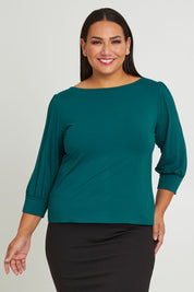 Model Ashleigh wearing size 16 of The Bamboo Boat Neck Top in colour Tealgreen (Green), from the front, cropped image