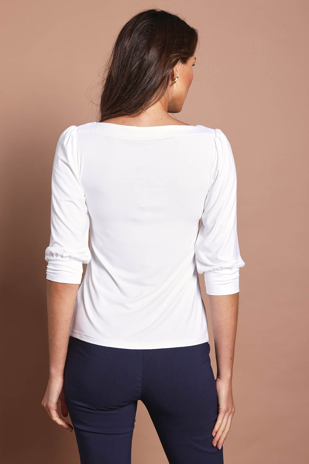 Model Madelinec wearing size 10 of the The Bamboo Boat Neck Top - White in colour White, from the back