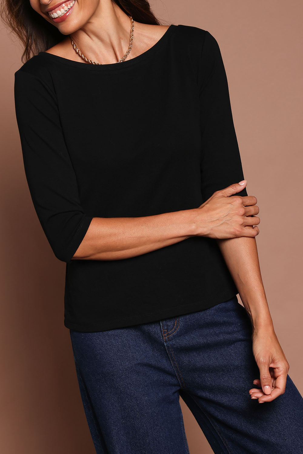 Model Amanda wearing size 10 of The Reversible Cotton Stretch Top in colour Black (Black), from the front, cropped image