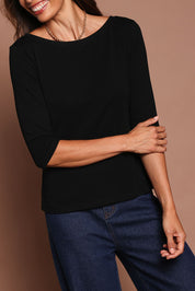 Model Amanda wearing size 10 of The Reversible Cotton Stretch Top in colour Black (Black), from the front, cropped image