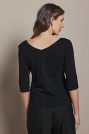 Model Madeline wearing size 10 of The Reversible Cotton Stretch Top in colour Black (Black), from the back