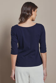 Model Madeline wearing size 10 of The Reversible Cotton Stretch Top in colour Navy (Blue), from the back
